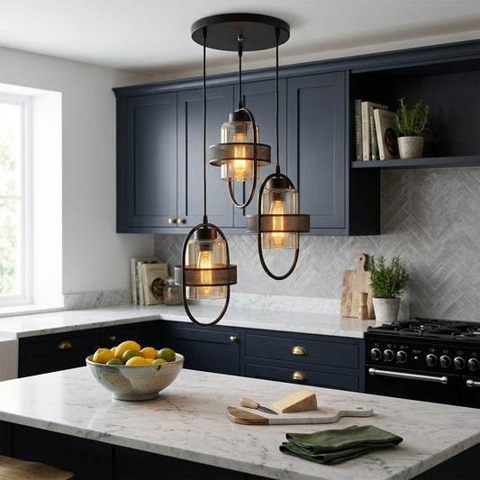 Industrial cage triple pendant light installed above a kitchen island.