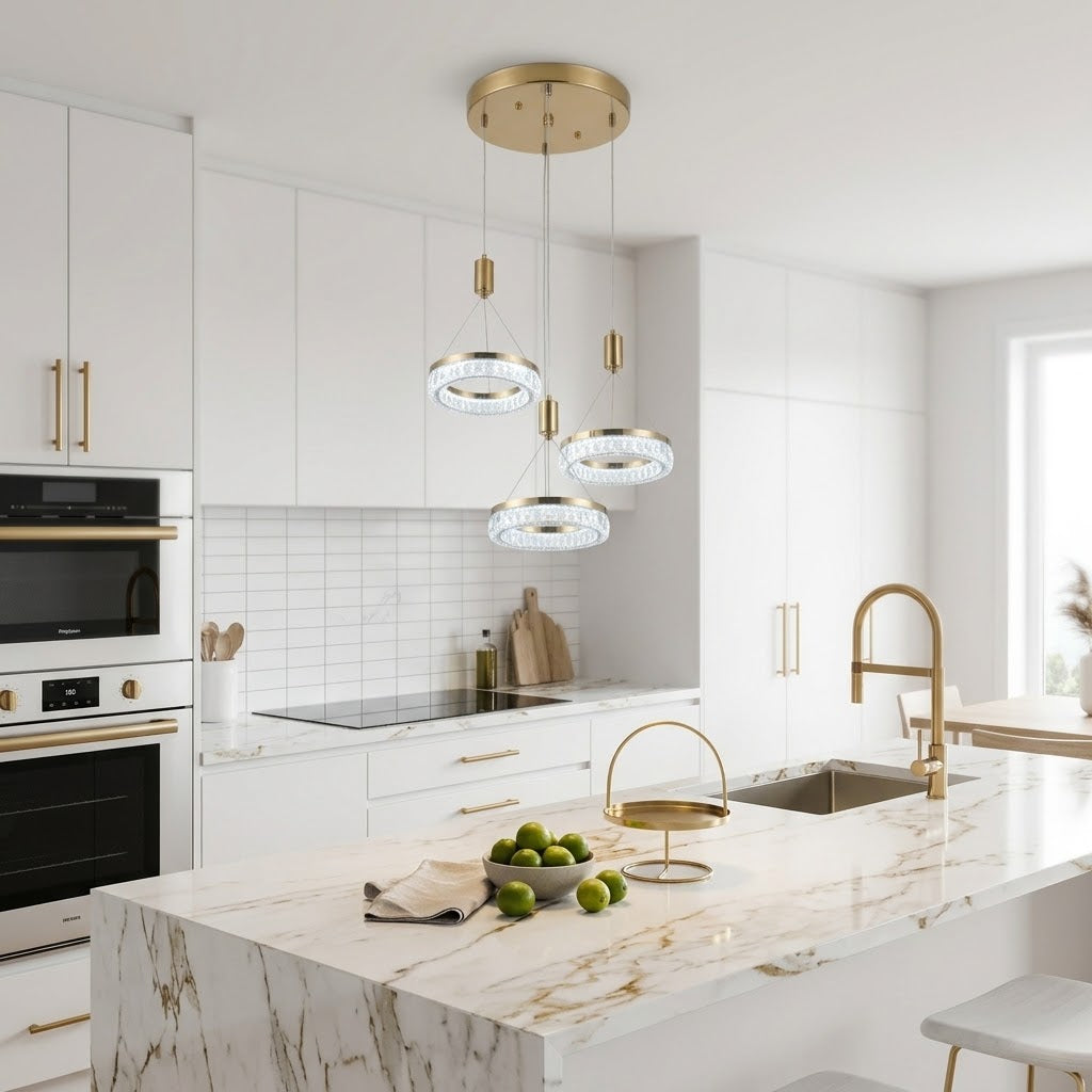 Gold LED tiered crystal ring pendant light installed above a kitchen island.