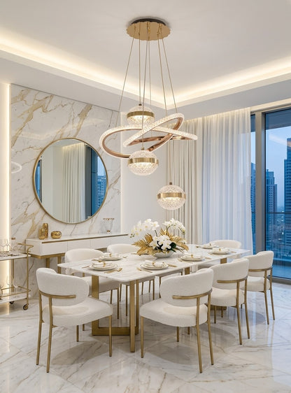 Gold LED multi-drop pendant light with crystal globes installed above a marble dining table.