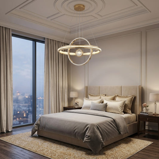 Gold LED orbital ring pendant light installed above a bed in a luxury bedroom.