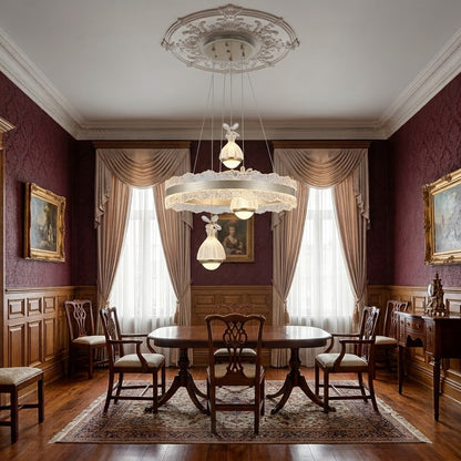 Champagne LED lace-edge ring pendant light installed above a dining table in a traditional dining room.