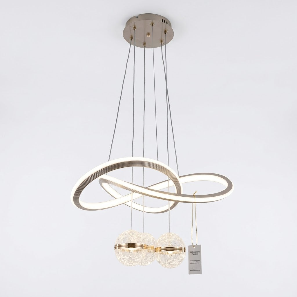 Champagne-finished LED loop pendant light with crystal globes, shown on a white background.