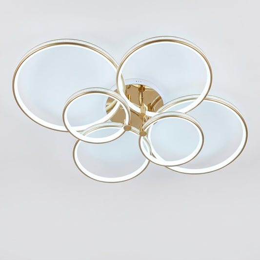 Luxury modern LED ceiling light with interlocking gold rings, shown on a white background.
