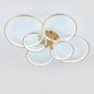 Luxury modern LED ceiling light with interlocking gold rings, shown on a white background.