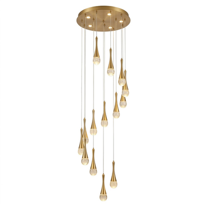 Gold cascading teardrop stair chandelier hanging in a double-height living room.