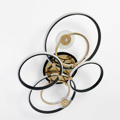 Luxury LED ceiling light with interlocking black and gold rings, shown on a white background.