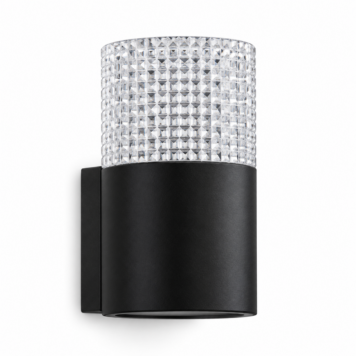 A textured, crystal-effect cylinder shade sits on a sleek black round body with a solid wall bracket, scattering the light into a soft glittering glow after dark.
