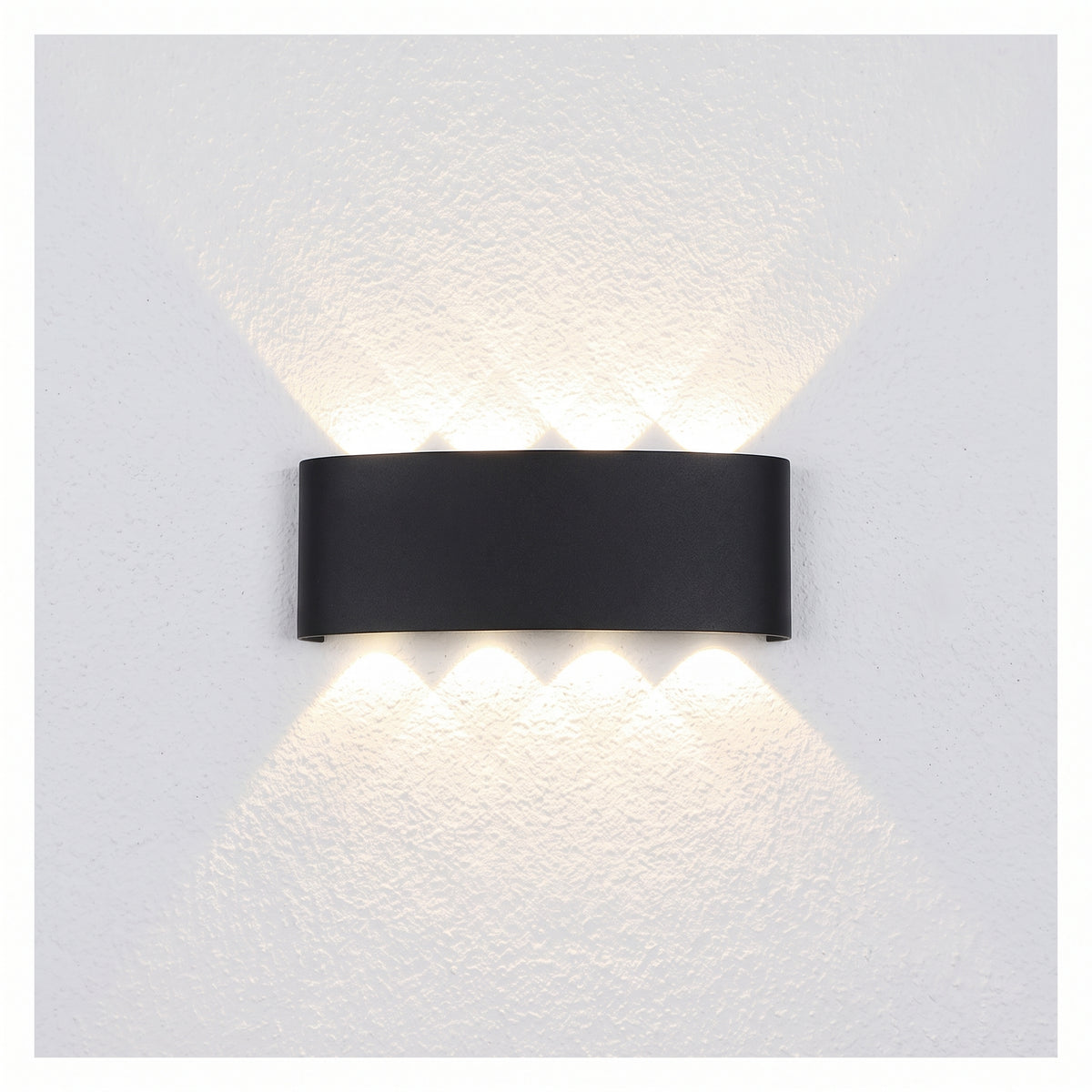 Modern black architectural LED wall sconce with a curved geometric body, shown on a white background.