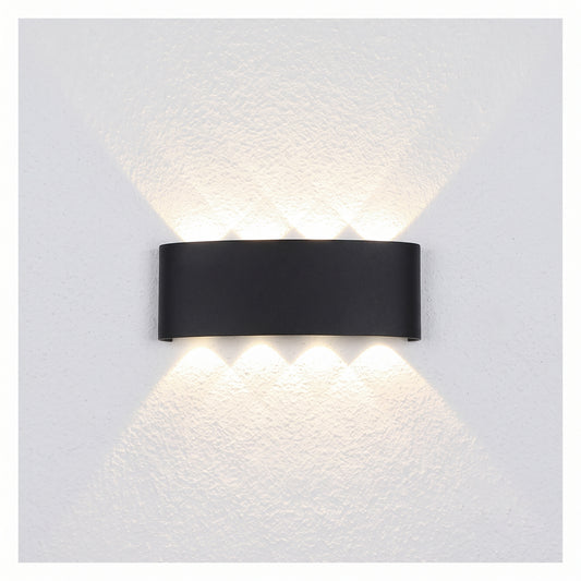 Modern black architectural LED wall sconce with a curved geometric body, shown on a white background.