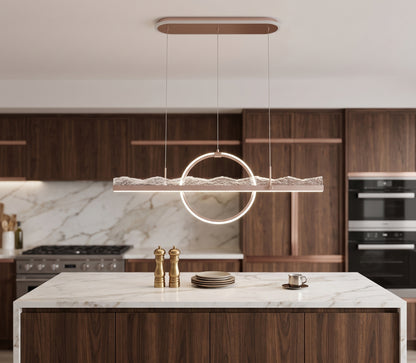 Grey LED linear pendant light with ring accent installed above a dining table.