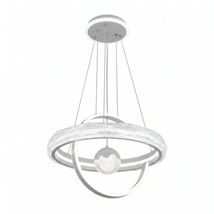 A modern LED pendant light in a soft white finish, featuring a large textured glass-effect ring, flowing LED ribbon curves, and a crystal-textured globe at its centre.