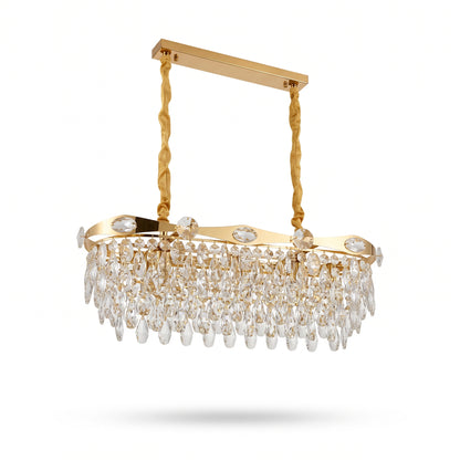 Gold linear oval crystal chandelier with cascading crystal drops and fabric-wrapped chains on a white background