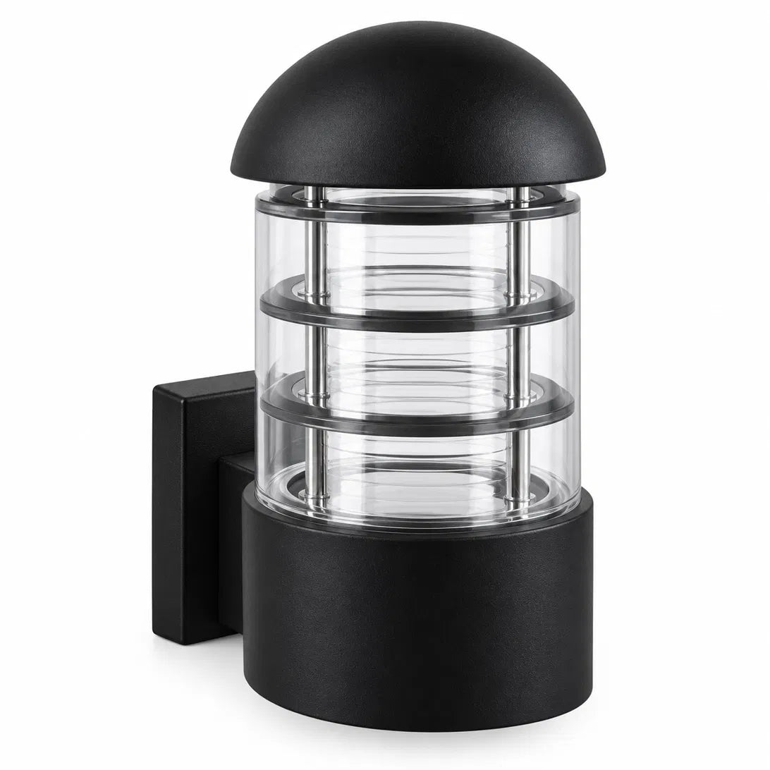A Sunrise Lion rounded outdoor wall lantern in black aluminium and glass, with a domed cap and a ribbed cage design that casts a warm, decorative glow on the wall.