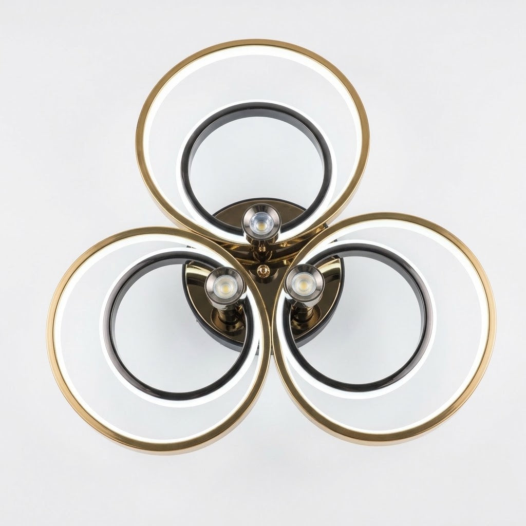 LED triple ring ceiling light in black and gold, shown on a white background.