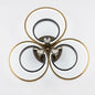 LED triple ring ceiling light in black and gold, shown on a white background.